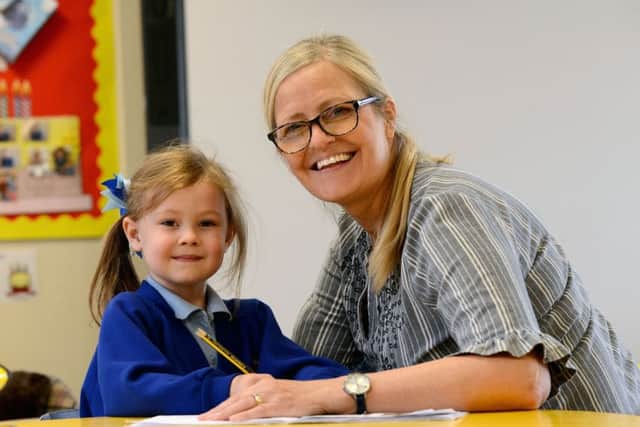 Ward Jackson Primary School teaching assistant Sharon Constantine working with pupil Ava Nolan. Picture by FRANK REID