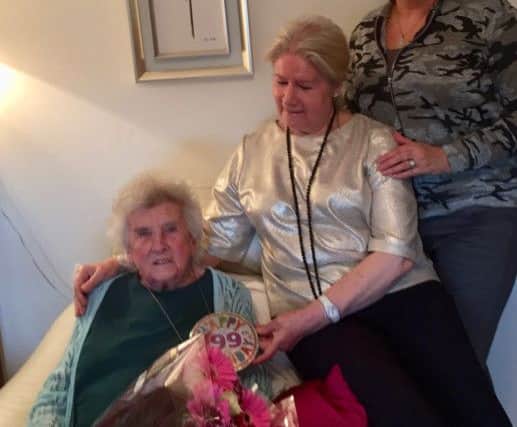 Minnie Nicol celebrating her 99th birthday alongside daughter Dorothy Robinson, middle, and granddaughter Wendy Horsley.