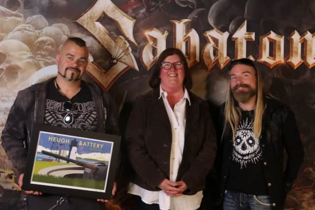 Heugh Battery Museum manager Diane Stephens with members of band  Sabaton who raised over £4,000 for the museum.