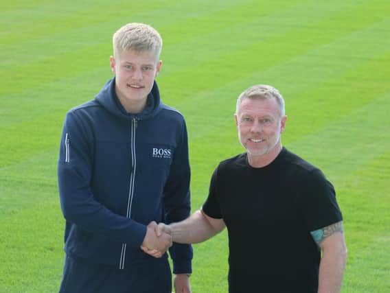 Brad Young with manager Craig Hignett (pic via HUFC).
