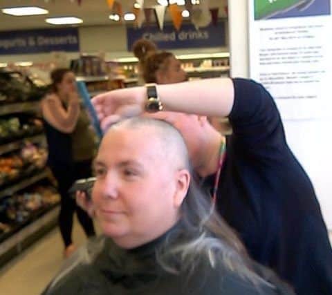 Madeline Jones had her head shaved in the middle of the supermarket where she works.
