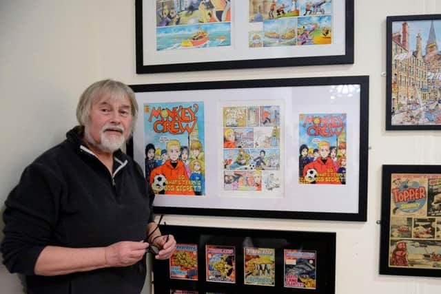 Hartlepool born illustrator and teacher Keith Robson in front of a display of his work in the Hartlepool Art Gallery. Pictures by Frank Reid.