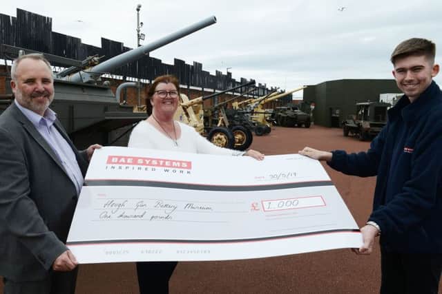 Heugh Gun Battery manager Diane Stephens is presented with a cheque for £1000 by BAE Washington Operation manager Les Cooper (left) and Joshua Grant operation apprentice.