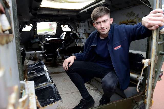 Joshua Grant operation apprentice at BAE Systems Washington inspecting one of the former military vehicles that is in need of repair at the Heugh Gun Battery.