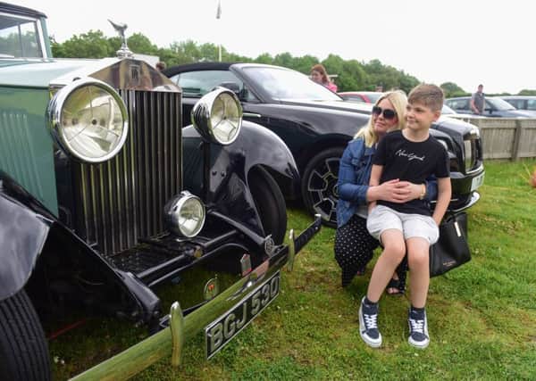 Emma and Noah (9) Thomspon of Hartlepool, admire a vintage Rolls Royce.