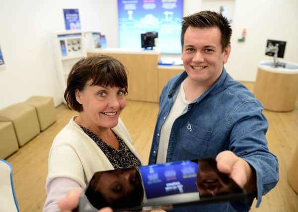 Julie Morfitt (project lead) and Nathan Todd (O2 sales advisor) with one of the Tablets. Picture by FRANK REID
