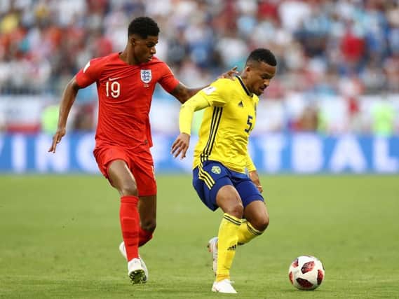 SAMARA, RUSSIA - JULY 07:  Martin Olsson of Sweden is challenged by Marcus Rashford of England during the 2018 FIFA World Cup Russia Quarter Final match between Sweden and England at Samara Arena on July 7, 2018 in Samara, Russia.  (Photo by Ryan Pierse/Getty Images)