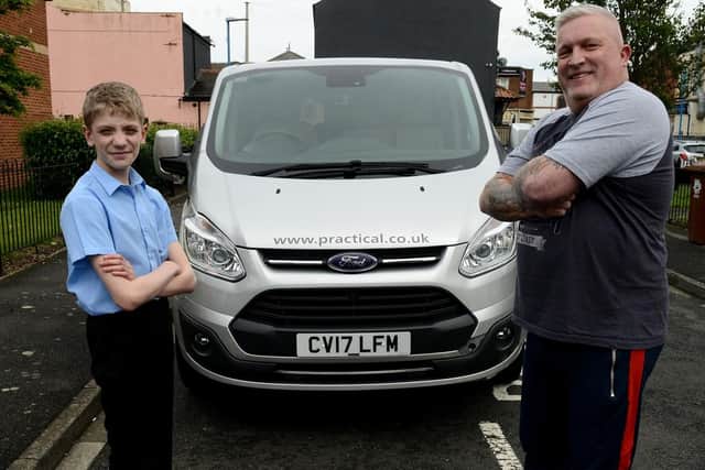 Joshua Dawson (left) and Kevin Hill from Bring Back a Smile with the donated minibus. Picture by FRANK REID