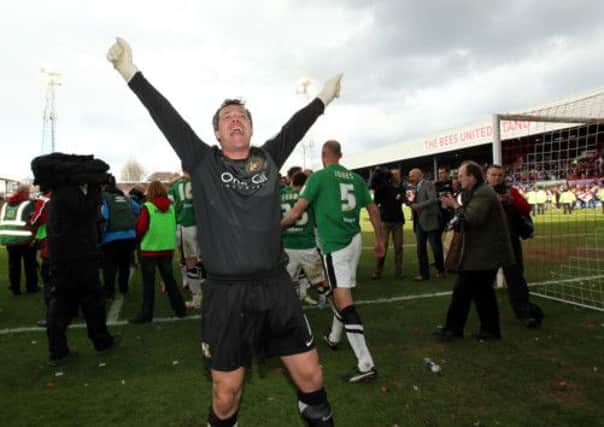 Doncaster's Neil Sullivan celebrates winning League One at Griffin Park, Brentford.