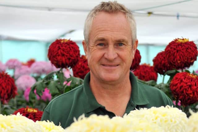 John Peace, Parks and Facilities Manager for Monkhesleden Parish Council attending his chrysanthemums.