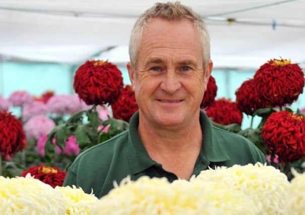 John Peace, Parks and Facilities Manager for Monkhesleden Parish Council attending his chrysanthemums.