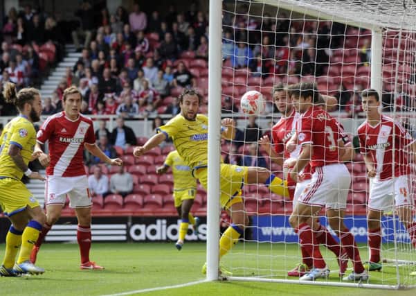 STATUES: .Owls Atdhe Nuhiu knocks in the first goal past a dozing Boro defence
