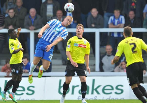 HEAD MAN: Scott Harrison in action against Tranmere Rovers. Picture by FRANK REID