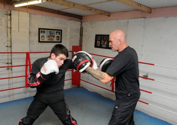 Boxer Tommy Ward in training with coach Neil Fannan