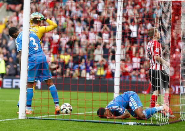 Sunderland's Patrick van Aanholt (3) and Liam Bridcutt are unable to stop Southampton's Graziano Pelle from scoring his second during the Barclays Premier League match at St. Mary's Stadium