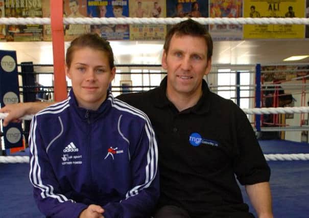 BOXER AND COACH: Savannah Marshall and her coach Tim Coulter at the Headland gym