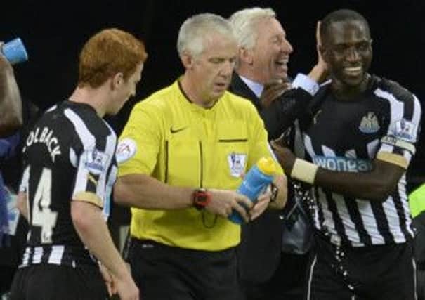 WE DID IT: Newcastle's Moussa Sissoko celebrates his goal with manager Alan Pardew