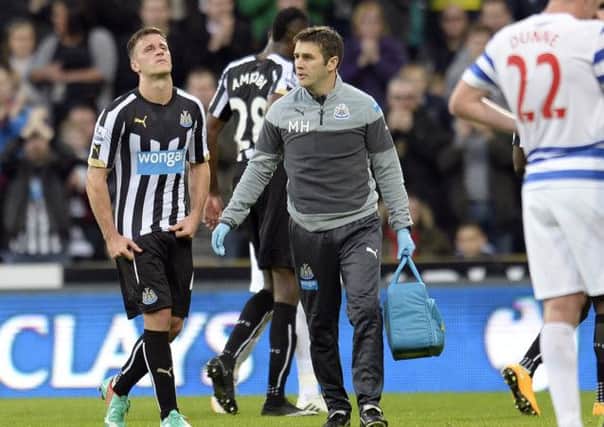 PAINFUL EXIT: Newcastle's Ryan Taylor goes off injured