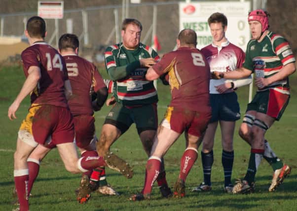 BRINKBURN BATTLE: West Hartlepoo (Green) scrap for the ball with Wheatley Hills. Picture by JOE SPENCE