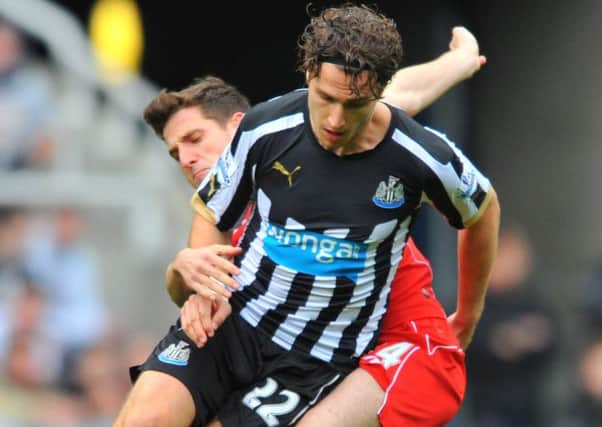 GOING DUTCH: Daryl Janmaat in action against Liverpool.