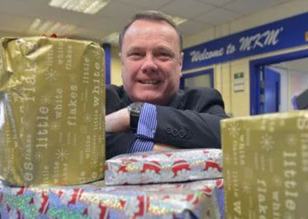 Mick Sumpter, director at MKM, with Christmas presents