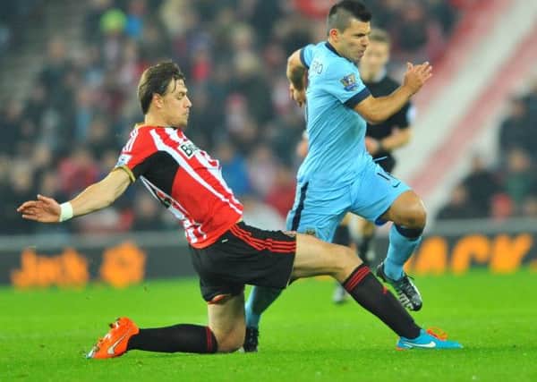 PUTTING HIS FOOT IN: Sebastian Coates in action against Manchester City. Picture by FRANK REID