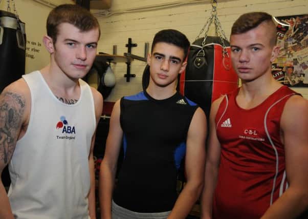 RING MASTERS: Elite Boxing Academy 

Gus Robinson boxers (l to r) Adam Cope, 18, Darren Coombs, 14 and Luke Cope, 17.