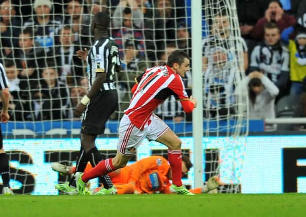 Adam Johnson turns away to celebrate after scoring  for Sunderland against Newcastle. Picture by FRANK REID