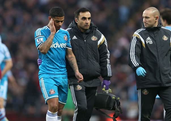 Sunderland's Liam Bridcutt (left) leaves the pitch after sustaining an injury during the Barclays Premier League match at Villa Park