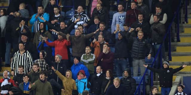ABUSE ... Newcastle fans boo the players at the final whistle.