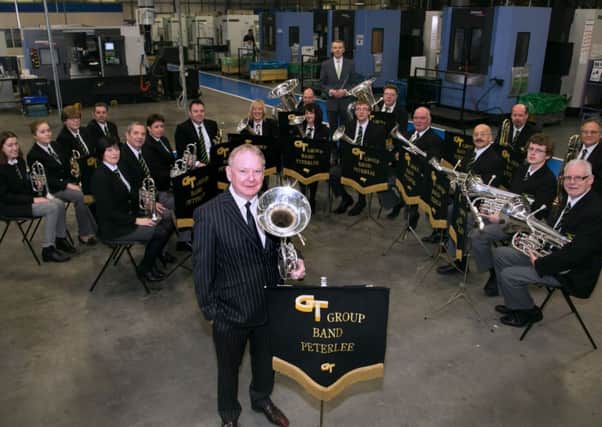 DELIGHT: Chairman Geoff Turnbull with the GT Group Band Peterlee