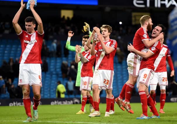 CITY SLICKERS: Middlesbrough's players celebrate at the end at the Etihad Stadium