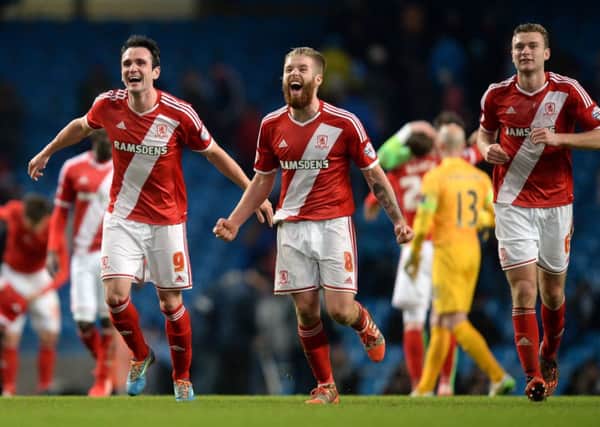 WE DID IT:  Kike, Adam Clayton and Ben Gibson celebrate after the FA Cup Fourth Round win for Boro at Man City
