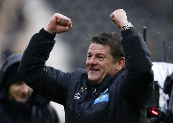 Newcastle United's John Carver celebrates after the Barclays Premier League match at the KC Stadium, Hull