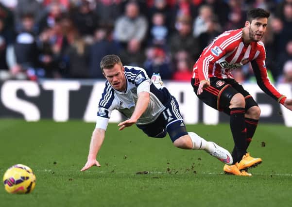 Ricky Alvarez brings down West Brom's Chris Brunt to earn a booking today
