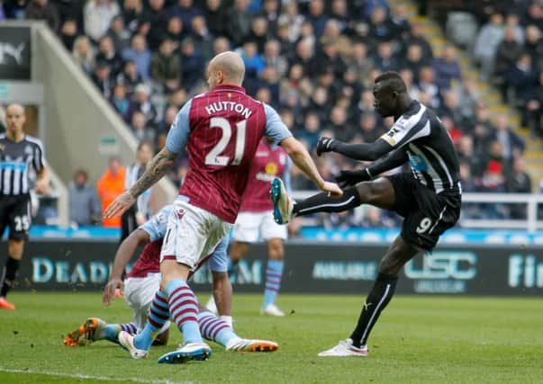 Newcastle United's Papiss Demba Cisse scores against Villa