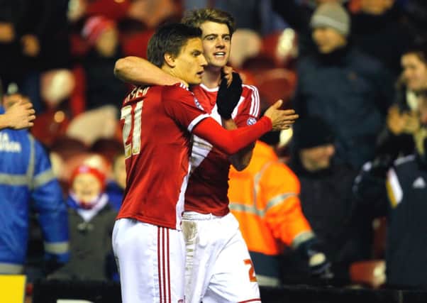 WELL DONE PAL: Middlesbrough's Jelle Vossen is congratulated by Patrick Bamford after scoring in the win over Millwall