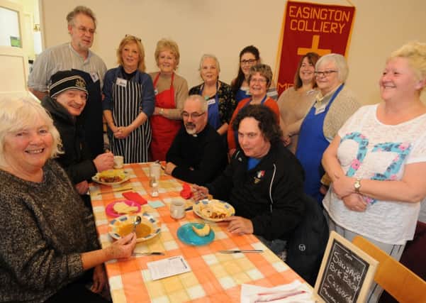 Eating well... Rev Christopher Wood-Archer joins local residents from Easington Colliery at The Together Cafe in Seaside Lane, along with the team of volunteers who have helped to may the venture a big success.