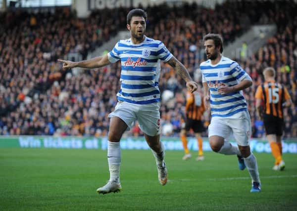 Queens Park Rangers' Charlie Austin celebrates scoring his teams first goal of the game during the Barclays Premier League match at the KC Stadium, Hull. PRESS ASSOCIATION Photo. Picture date: Saturday February 21, 2015. See PA story SOCCER Hull. Photo credit should read: Ryan Browne/PA Wire. RESTRICTIONS: Editorial use only. Maximum 45 images during a match. No video emulation or promotion as 'live'. No use in games, competitions, merchandise, betting or single club/player services. No use with unofficial audio, video, data, fixtures or club/league logos.
