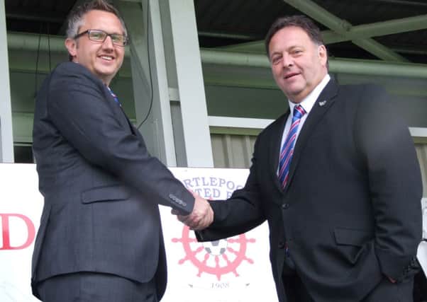 New chairman Gary Coxall is welcomed by chief executive Russ Green