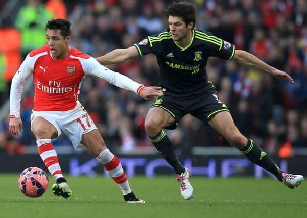 George Friend (right) battles for the ball with Arsenal's Alexis Sanchez at the Emirates
