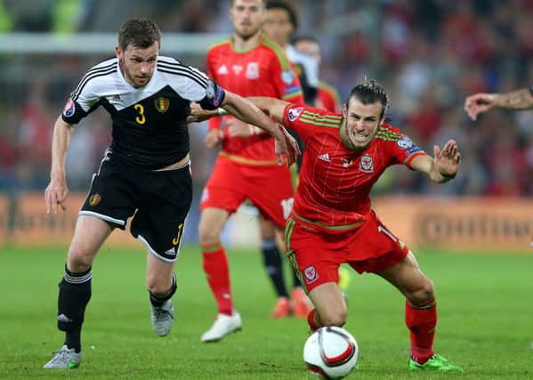 Belgium's Nicolas Lombaerts (left) up against Wales' Gareth Bale last month