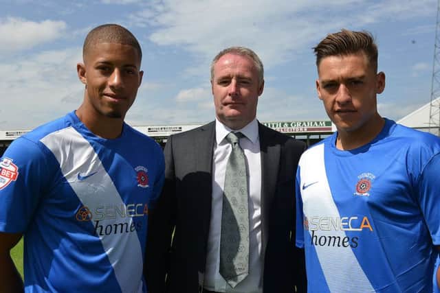 Jake Carroll (left) and Scott Fenwick (right) in the 2015-16 strip alongsideSteve Lumsdon from kit sponsor, Seneca Homes. Picture by FRANK REID