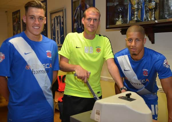 Kit manager Marty Brown with Jake Carroll and Scott Fenwick in the 2015-16 strip. Picture by FRANK REID