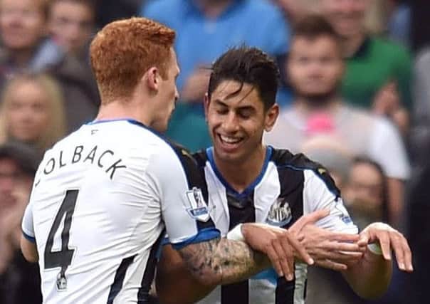 Newcastle United's Ayoze Perez (second left) celebrates scoring his side's third goal with Jack Colback (left) and Moussa Sissoko during the Barclays Premier League match at St James' Park, Newcastle. PRESS ASSOCIATION Photo. Picture date: Sunday October 18, 2015. See PA story SOCCER Newcastle. Photo credit should read: Owen Humphreys/PA Wire. RESTRICTIONS: EDITORIAL USE ONLY No use with unauthorised audio, video, data, fixture lists, club/league logos or "live" services. Online in-match use limited to 45 images, no video emulation. No use in betting, games or single club/league/player publications.