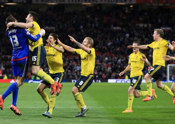 Middlesbrough goalkeeper Tomas Mejias (left) celebrates saving the decisive penalty with teammates at Old Trafford