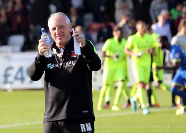 Hartlepool United boss Ronnie Moore acknowledges the away fans prior to kick-off at Wimbledon