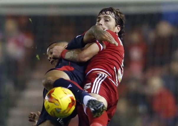 Middlesbrough's Fernando Amorebieta and Rotherham United's Jonson Clarke-Harris (left) battle for the ball during the Sky Bet Championship match at the Riverside Stadium, Middlesbrough. PRESS ASSOCIATION Photo. Picture date: Tuesday November 3, 2015. See PA story SOCCER Middlesbrough. Photo credit should read: Owen Humphreys/PA Wire. RESTRICTIONS: EDITORIAL USE ONLY No use with unauthorised audio, video, data, fixture lists, club/league logos or "live" services. Online in-match use limited to 45 images, no video emulation. No use in betting, games or single club/league/player