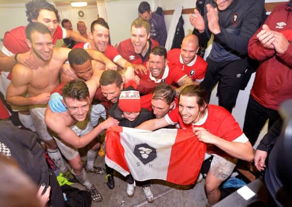 James Poole (front right) celebrates with his Salford City team-mates after beating Notts County