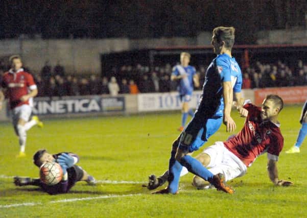 Jake Gray is denied at Salford City by keeper Jay Lynch